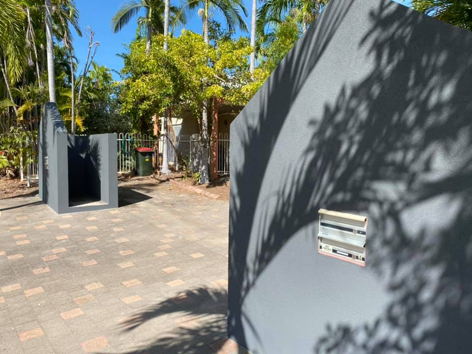 After: the outdoor wall structure finished in smooth dark grey render